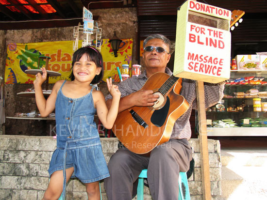 Blind man and accompanying singer, Cebu, Philippines. (PHCeb4388)