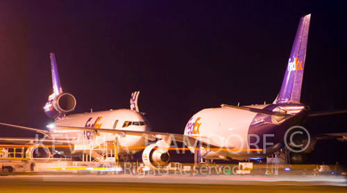 A MD11(left) and an Airbus A310 (right) undergo cargo loading at the Fedex Subic Bay Asia Hub on the final night of Philippine operations.  February 5th / 6th 2009.
